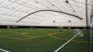 The six-year-old boy was attending a birthday party at an indoor football pitch when he was struck by a falling goalpost.